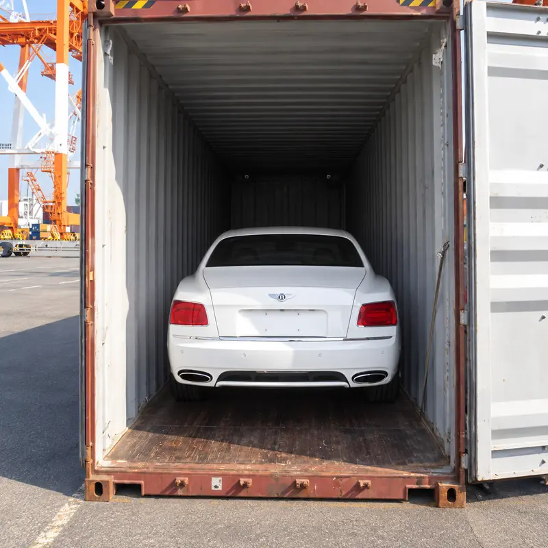 White Bentley loaded inside an export container at a Japanese port