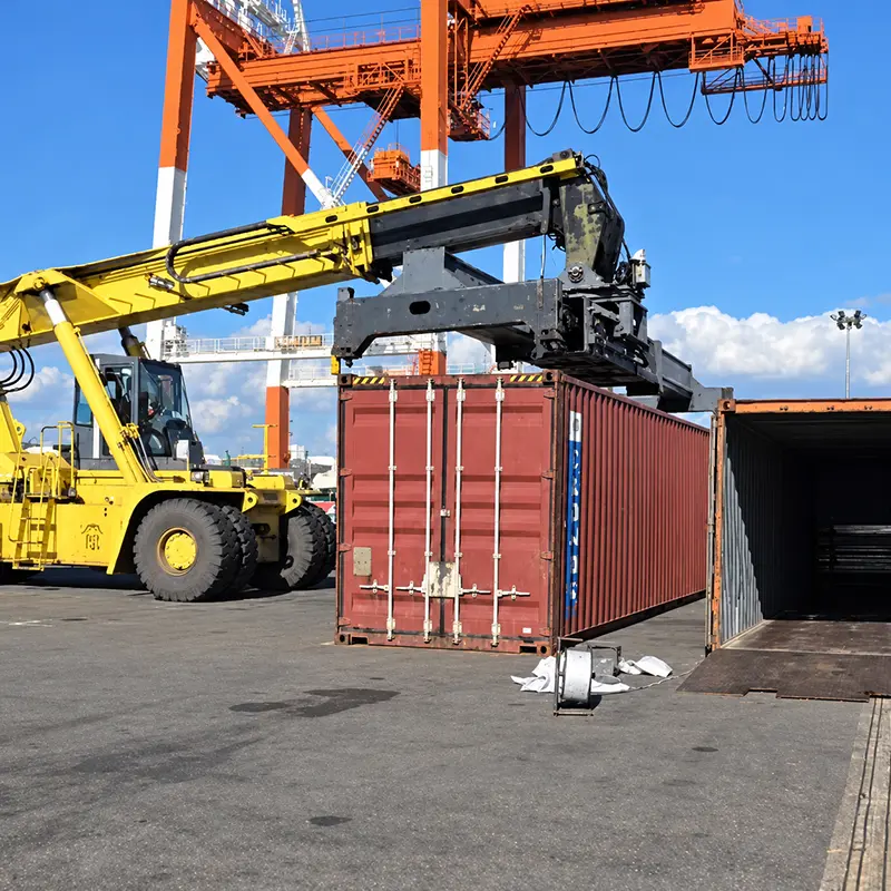 Shipping container being handled at a Japanese export port